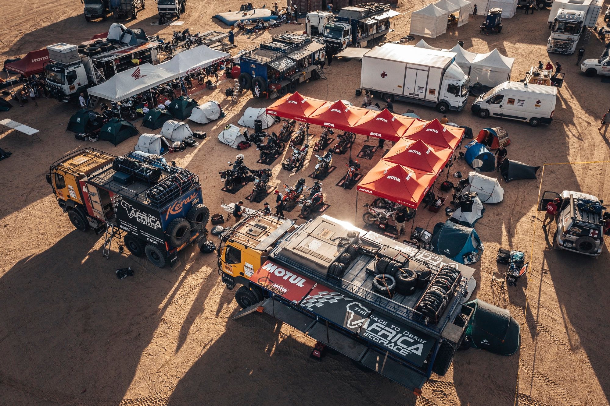 Motul Xtreme Riders bivouaq from drone with all bikes  and pilots working on them during Africa Eco Race rally raid